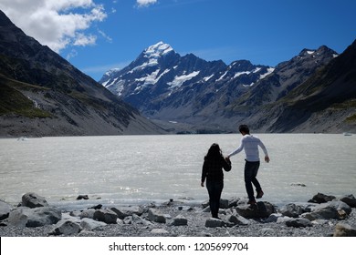 NEW ZEALAND, SOUTH ISLAND, MOUNT COOK - FEBRUARY 2016: An Unidentified Couple Explores Mount Cook,New Zealand. Working Holiday Visa Is A Popular Way To Explore New Zealand And Other Countries.