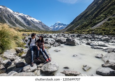 NEW ZEALAND, SOUTH ISLAND, MOUNT COOK - FEBRUARY 2016: An Unidentified Couple Explores Mount Cook,New Zealand. Working Holiday Visa Is A Popular Way To Explore New Zealand And Other Countries.