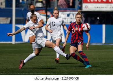New Zealand's Ria Perecival (2) and United States' Kristie Mewis (22) vie for the ball during the She Believes Cup soccer match Feb. 20, 2022, in Carson, Calif.