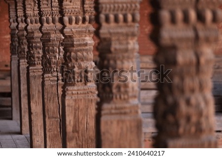 Newar plural column in Bhaktapur durbar square in kathmandu, show a traditional Nepalese cultural wood sculpture