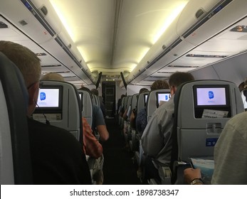 Newark, NJ - 18 August 2018:  Passengers waiting for take off on a United Airline flight at Newark Airport in New Jersey, USA.