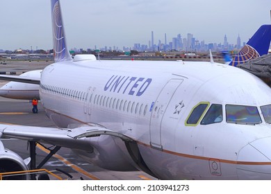 NEWARK, NJ -2 NOV 2021- View of an airplane from United Airlines (UA) with the New York City skyline in the background at Newark Liberty International Airport (EWR) in New Jersey.