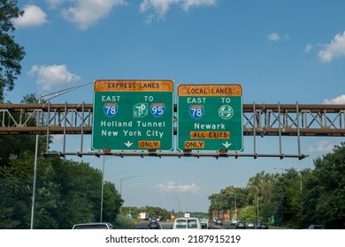 Newark, NJ - August 02-2022: 
Express Lanes East Interstate 78 To Turnpike,Interstate 95,Local Lane To Garden State Parkway Sign