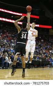 NEWARK, NJ - DEC 9: Florida Gators Forward Egor Koulechov (4) Shoots Over Cincinnati Bearcats Jarron Cumberland (34) On December 9, 2017 At The Prudential Center On  Newark, New Jersey.