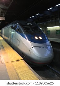 Newark, NJ, USA March 6, 2018 An Acela Express Amtrak train stops in Penn Station in Newark, New Jersey, one of its stops on the Northeast Corridor