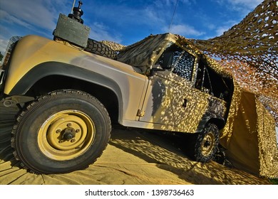 Newark, Nottinghamshire, England, Britain, October 2006, British Army Land Rover Under Camoflage Netting At Vehicle Show