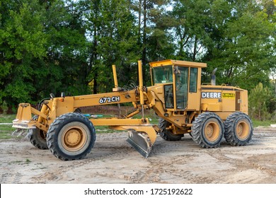 NEWBERRY, FLORIDA - April 6, 2020: A road construction grader parked in the Arbor Greens subdivision off Newberry Road where new housing construction will begin once the road has been completed.