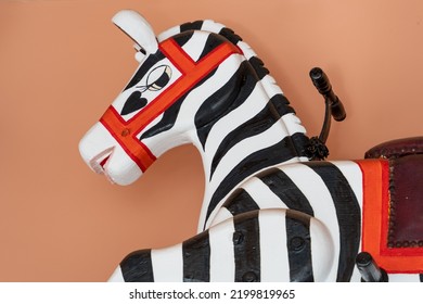 Newbiggin By The Sea, Northumberland, UK: September 4th, 2022: Vintage Handpainted Child's Funfair Ride Seat In The Shape Of A Zebra, Mounted On The Wall At Caffe Bertorelli.