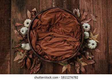 Newborn Autumn Background - Wooden Bowl With Fall Leaves And Cream Pumpkins On Dark Wooden Planks Backdrop.