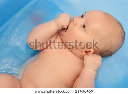 Similar – Image, Stock Photo Newborn in the bathtub held by her mother