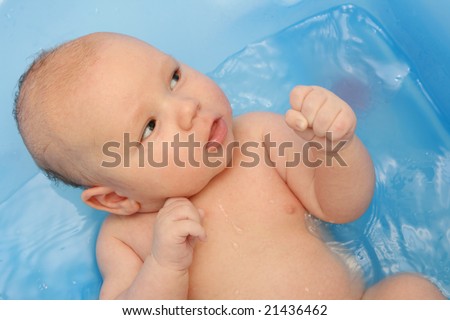 Similar – Image, Stock Photo Newborn in the bathtub held by her mother