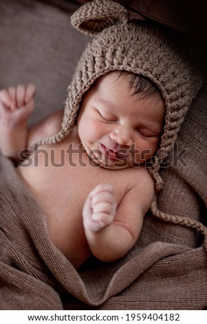 Similar – Newborn baby girl sleeping lying on bed next to mother’s hand