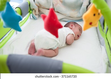 Newborn Baby In Bed