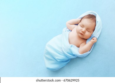 Newborn Baby Boy Sleep On Blue Blanket