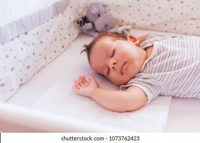 Newborn Baby Boy Sleeping In Crib