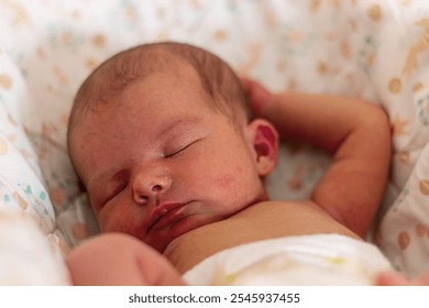 Newborn baby boy sleeping in his crib. Shallow depth of field - Powered by Shutterstock