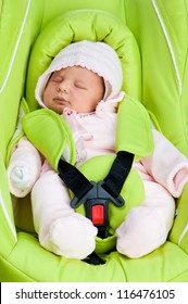 Newborn Baby In A Car Seat On A White Background