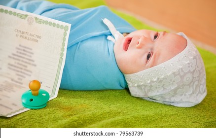 Newborn Baby With Certificate Of Birth