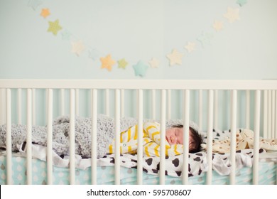 Newborn Baby In The Crib