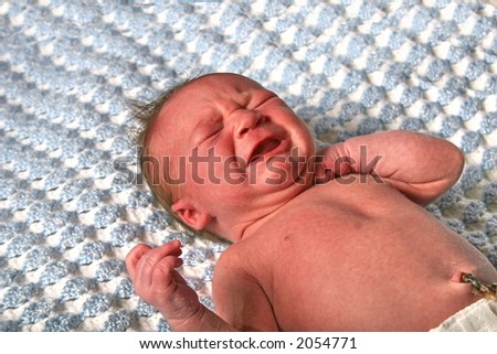 Similar – Baby yawning lying on a carpet