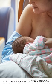 Newborn Baby Eating Breast Milk From Young Woman Mom