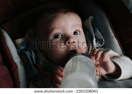 Similar – Baby taking feeding bottle