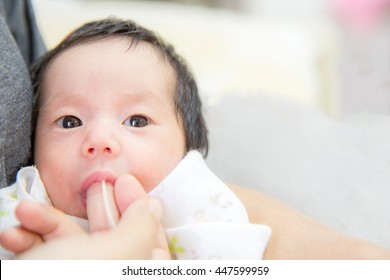 Newborn Baby Finger Feeding Breast Milk Using Tube