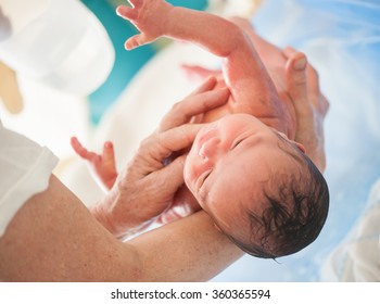 Newborn baby first bath