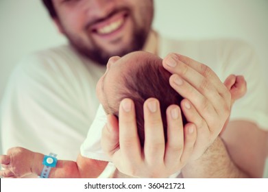 Newborn baby first days with his father