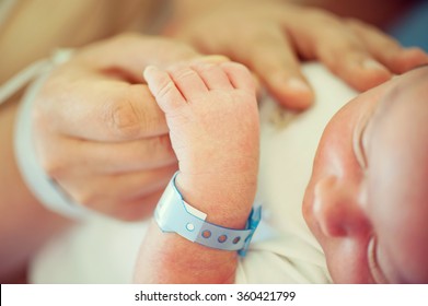 Newborn baby first days of life - Shutterstock ID 360421799