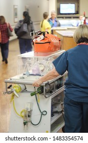 A Newborn Baby Gets Taken To The NICU Wing Of The Hospital By A Nurse