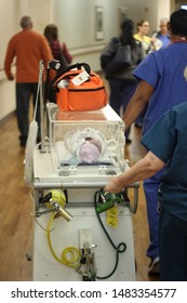 A Newborn Baby Gets Taken To The NICU Wing Of The Hospital By A Nurse