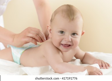 Newborn Baby getting oil massage