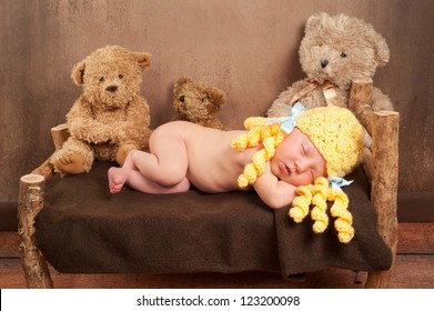 Newborn Baby Girl Dressed As Goldilocks And Sleeping On A Rustic Wooden Bed Surrounded By Three Plush Toy Bears.