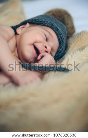 Similar – Newborn baby girl sleeping lying on bed next to mother’s hand