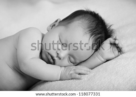 Newborn baby girl sleeping Black-white image