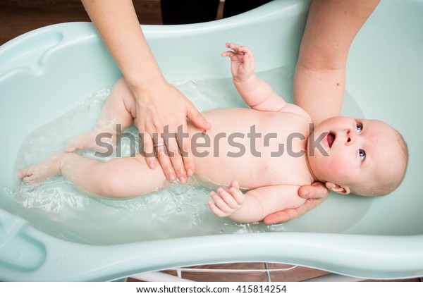 bathing a newborn baby girl