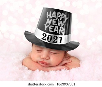 Newborn Baby Girl Wearing A 2021 Happy New Year Hat.