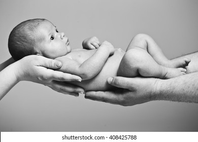 Newborn Baby In  Hand. Black And White Photography