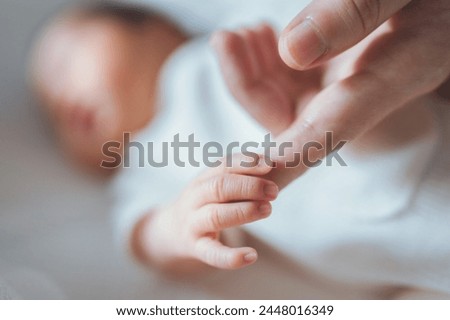 Similar – Baby sleeping on a blanket