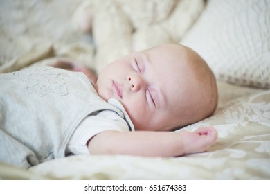 newborn baby with hat and some clothes. closeup