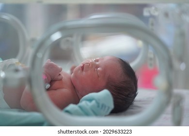 Newborn Baby ,her Skin Turned Red, She Is Sleeping In Hospital Crib At Delivery Room In Hospital.