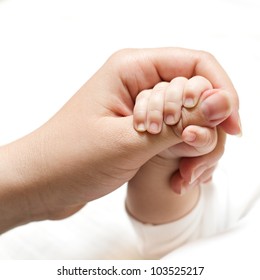 Newborn Baby Holding Mother Hand.