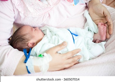 Newborn Baby In Hospital With Identification Bracelet Tag Name