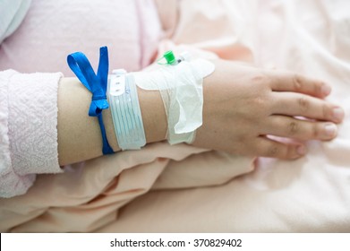 Newborn Baby In Hospital With Identification Bracelet Tag Name