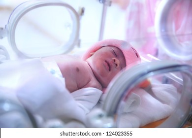Newborn baby in hospital post-delivery room