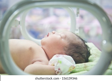 Newborn Baby In Incubator Care At Nursery