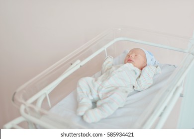 Newborn Baby Laying In Crib In  Prenatal Hospital