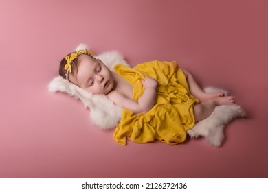 Newborn Baby Lies And Sleeps On A White Fur Blanket . Love