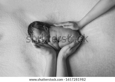 Similar – Newborn sleeping lying on blanket